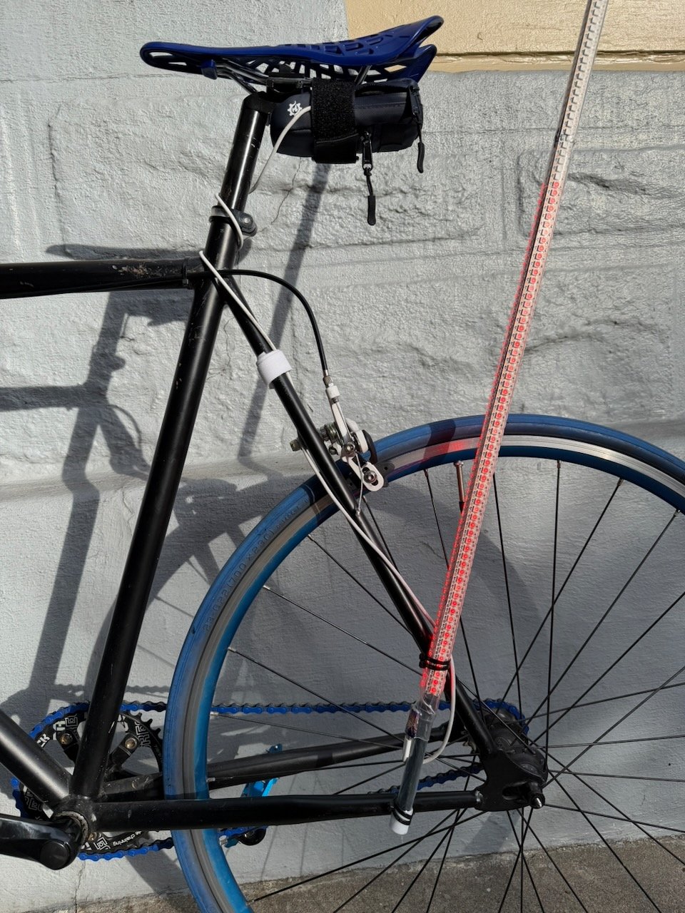 USB-C cable routed to saddle bag