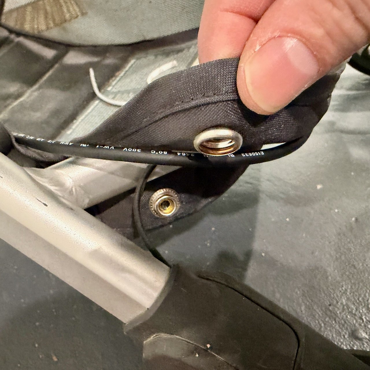 Routing wire across stroller - view 2